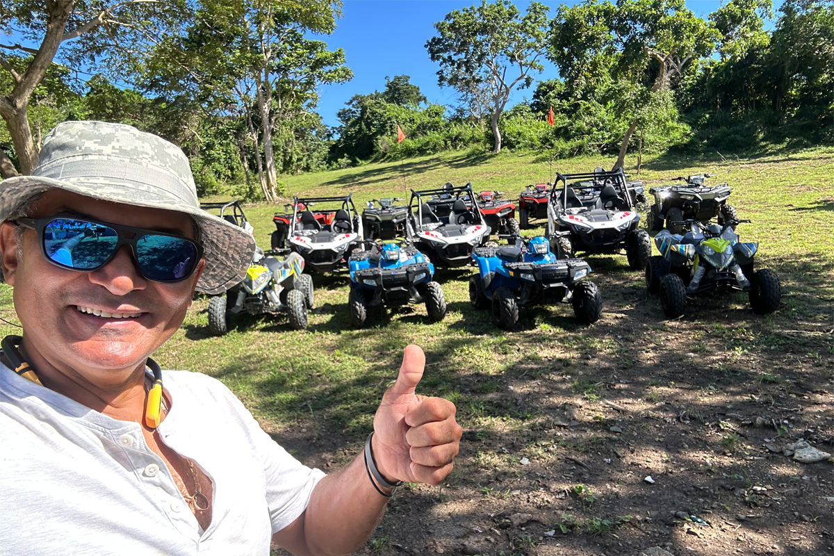 Adventure and Joy on Every Ride | ATV Puerto Rico LLC in Action Thrilled rider giving a thumbs-up while exploring lush trails on an ATV
