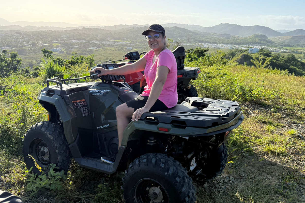 Discover the Thrill | ATV Puerto Rico LLC Riders in the Wild Customer waiting on an ATV, ready to start a guided off-road tour in Humacao, Puerto Rico