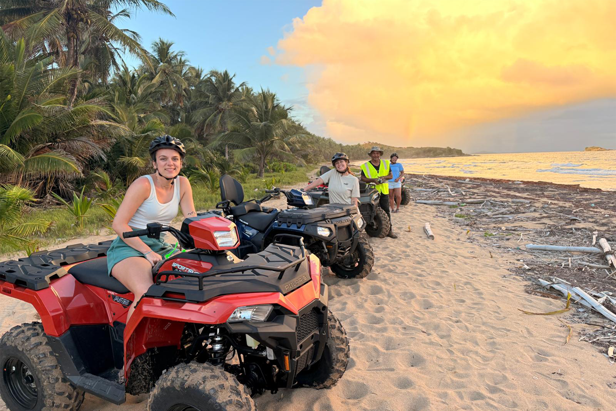 Beachside Adventure with ATV Puerto Rico LLC | Ride, Pose, Explore Customer on an ATV by the beach in Puerto Rico during a guided tour with ATV Puerto Rico LLC